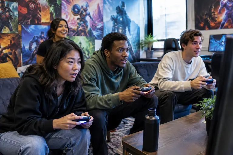 Gaming setup with shooter match replay and action-adventure scene on separate screens